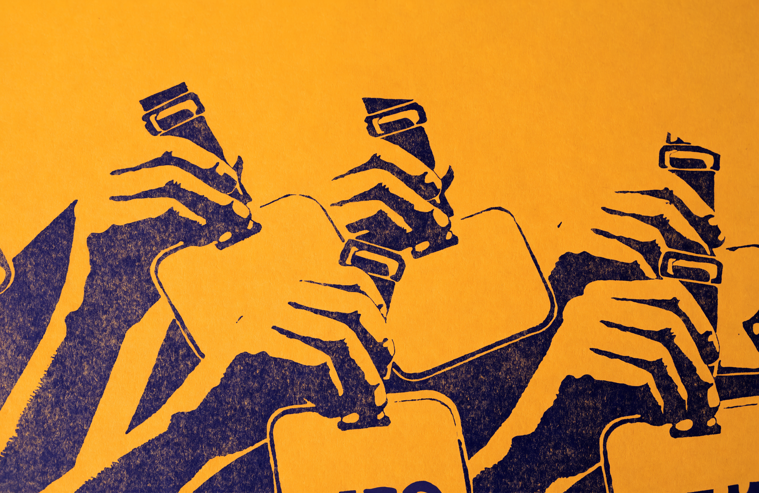 Two-ink screenprint close-up of raised hands holding blank conference badges on lanyards, printed in indigo on marigold paper.