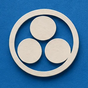 Detail: a cut-paper mon of three white circles turned around a centre inside a white ring.