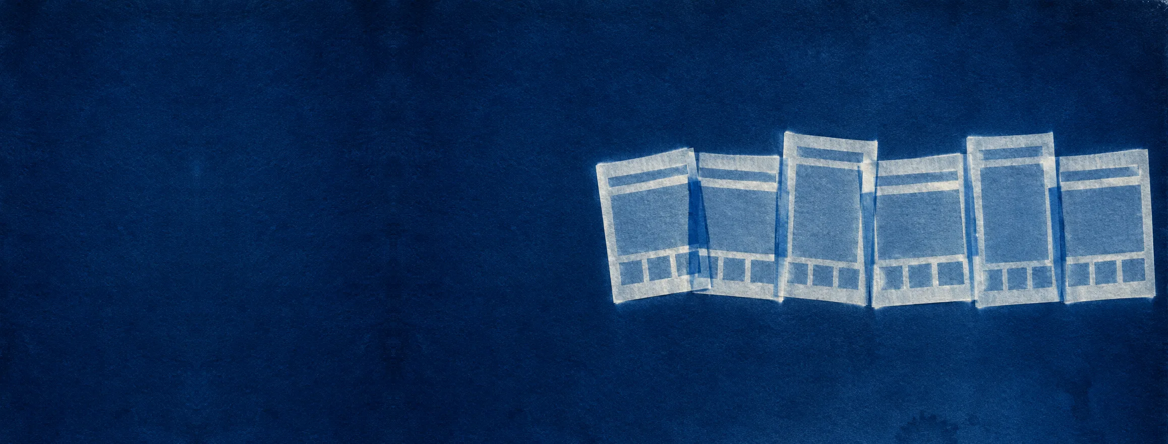A cyanotype photogram on deep Prussian blue paper: six translucent paper cut-outs of the same simple page layout laid in a loose row, each slightly shifted, printing as pale cream silhouettes.